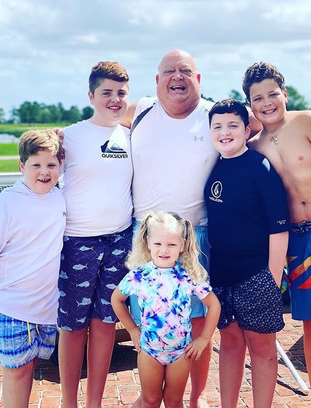 Dennis Silicato with his grandchildren